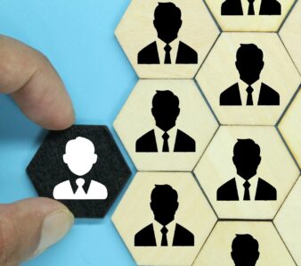 hexagon with an old employee icon and a new employee. the concept of workers or HR